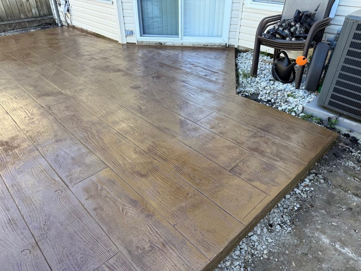 Stamped wood-plank concrete patio detail — Hampton Roads, VA