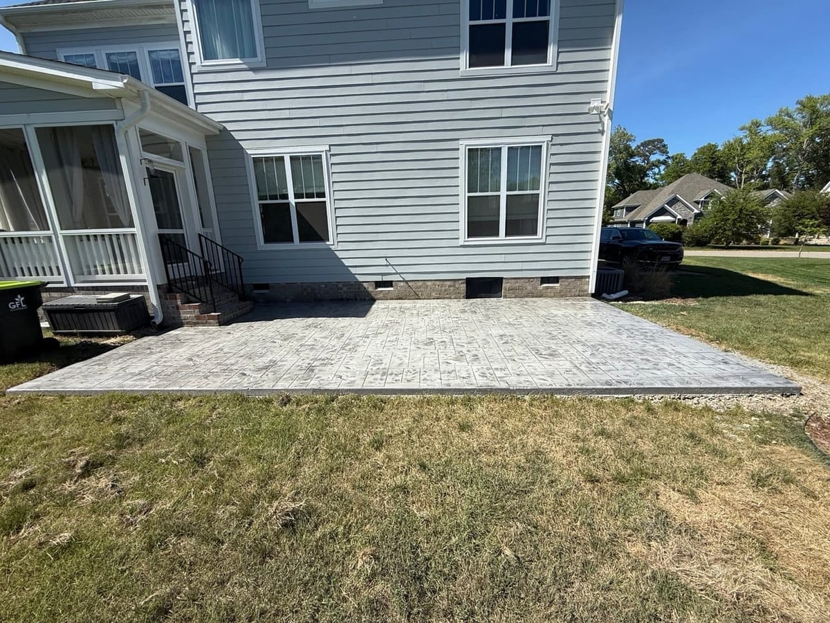 Stamped concrete patio in light gray-tan finish — Hampton Roads, VA